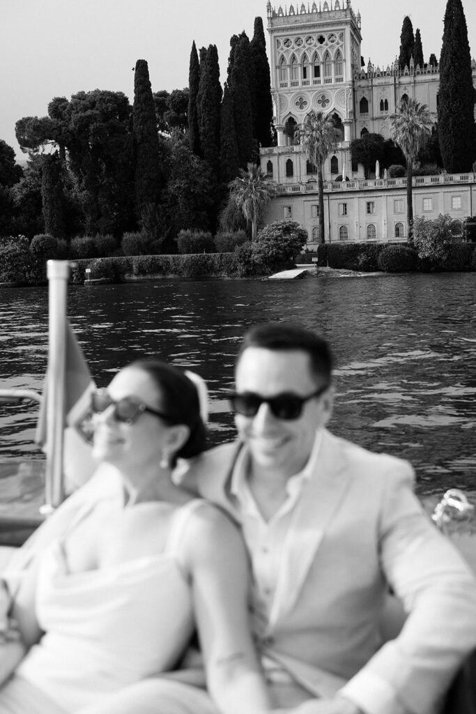 Couple on a private boat heading to Isola del Garda for their Lake Garda elopement