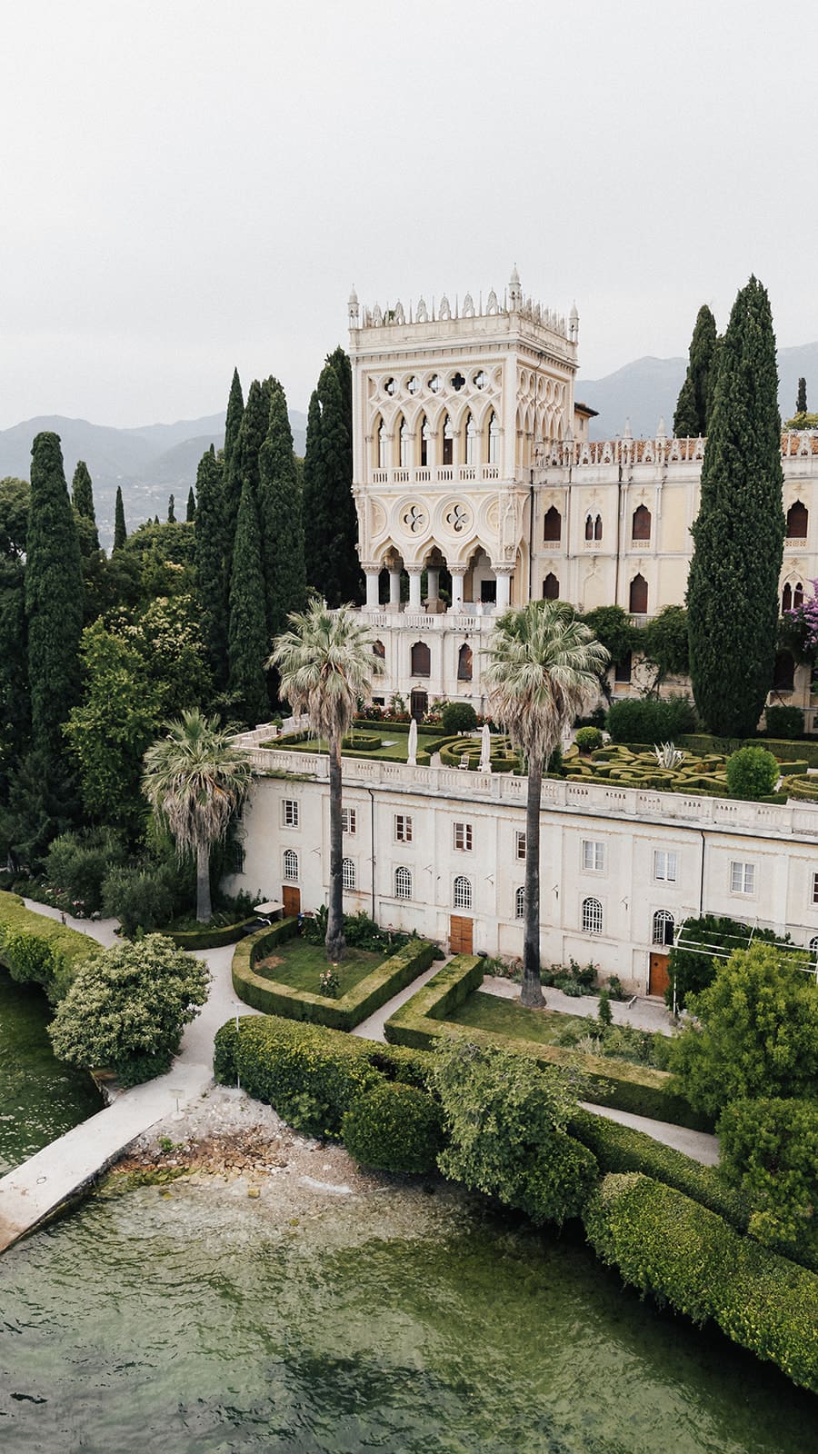 Luxury elopement photographer capturing a couple on Isola del Garda, Lake Garda, Italy