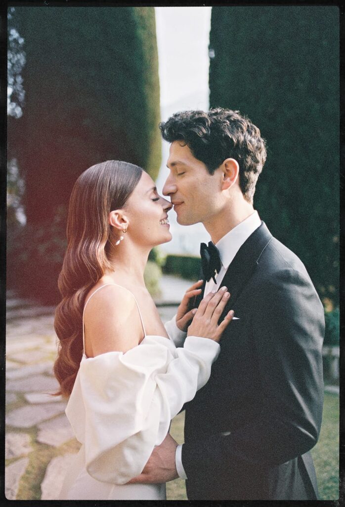 Romantic couple portrait on Isola del Garda by Italy film photographer and Super 8 wedding photographer