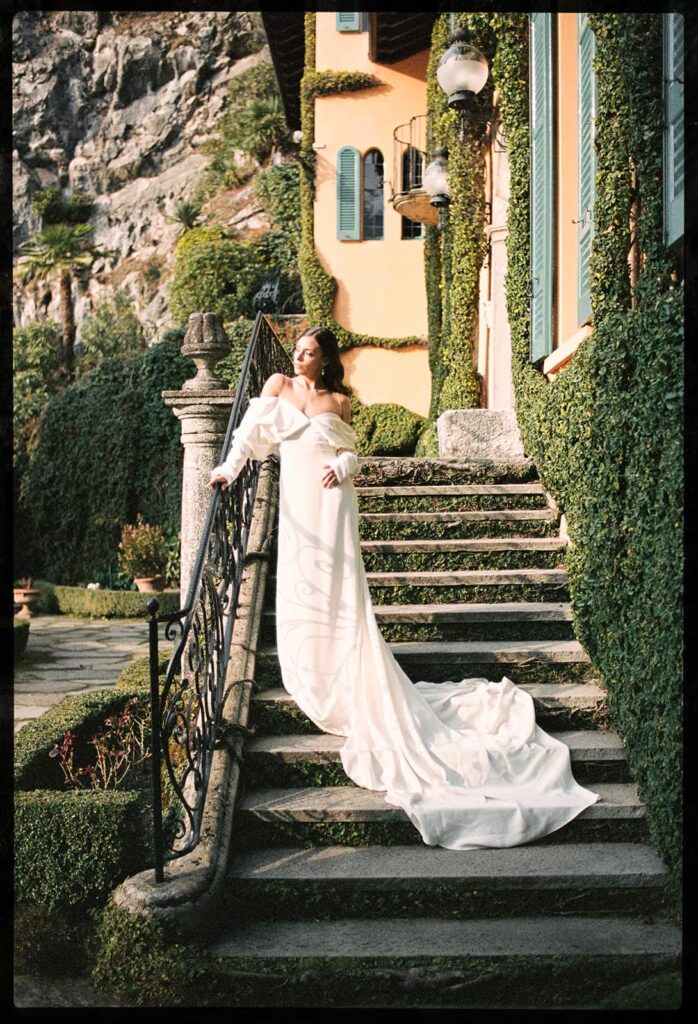 Bride standing on Italian villa steps during an Isola del Garda elopement wedding