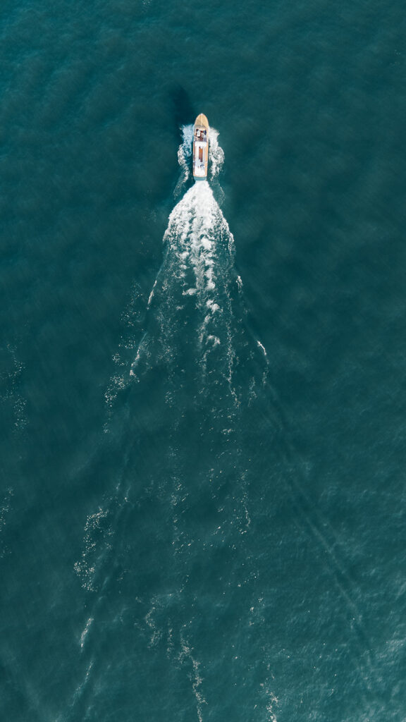 Boat moving across Lake Garda, captured during a destination elopement wedding