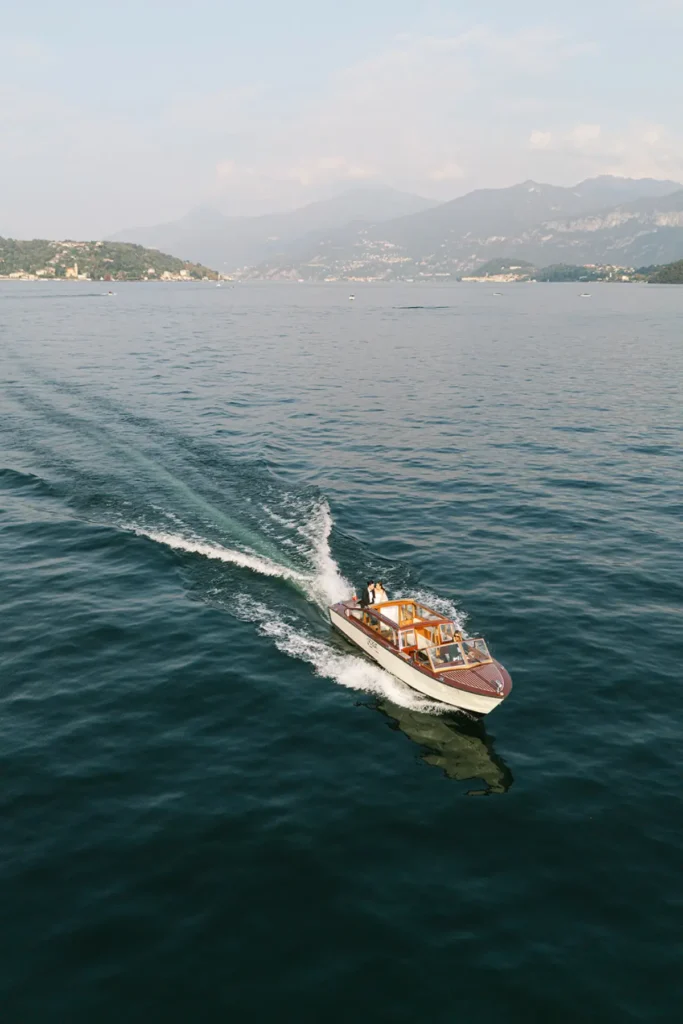Drone shot boat Wedding photographer lake como villa del balbianello elopement wedding cinematic on film super 8 vintage