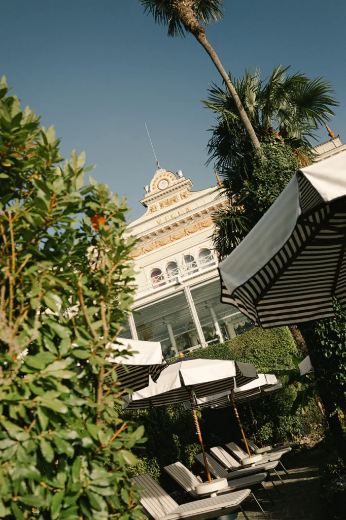 Garden and pool area at Grand Hotel Villa Serbelloni Bellagio with historic hotel façade
