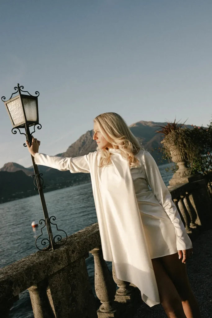 Bride-to-be by the lakeside balustrade at Villa Serbelloni Bellagio in soft afternoon light