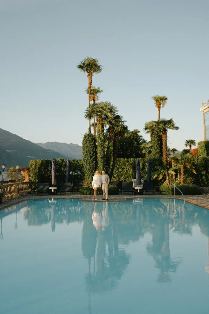 Pool view at Grand Hotel Villa Serbelloni Bellagio surrounded by palm trees and Lake Como scenery