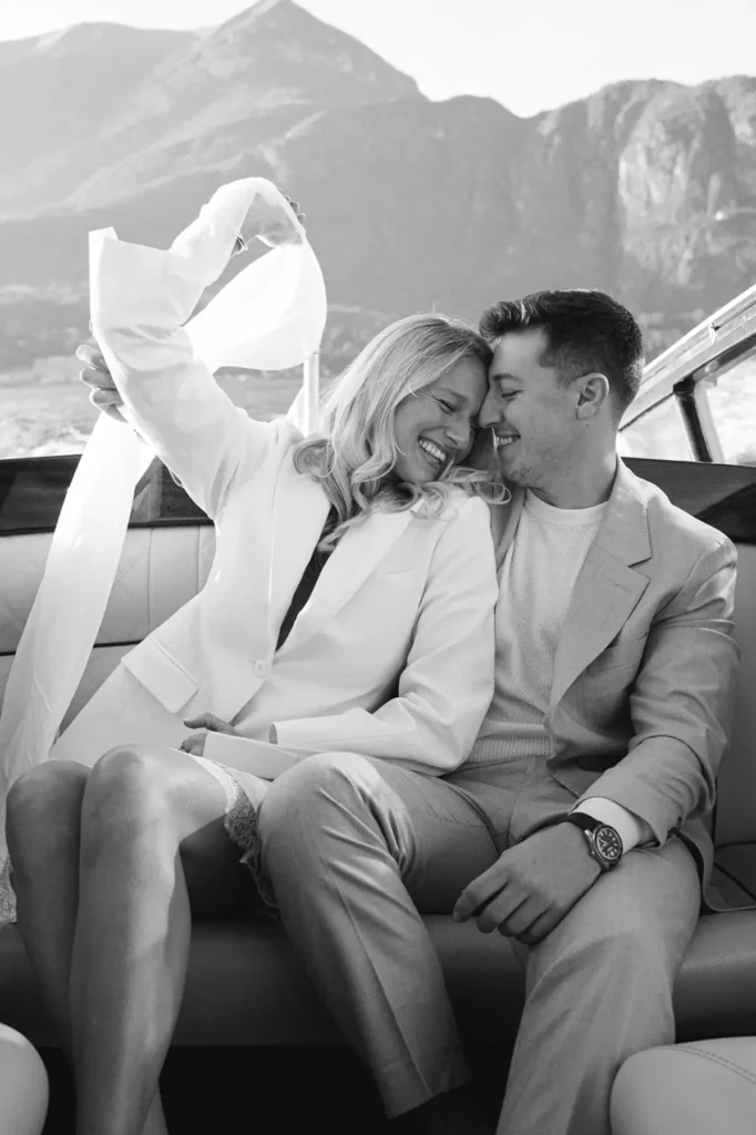 Romantic couple portrait on a boat on Lake Como near Bellagio, timeless black-and-white film style