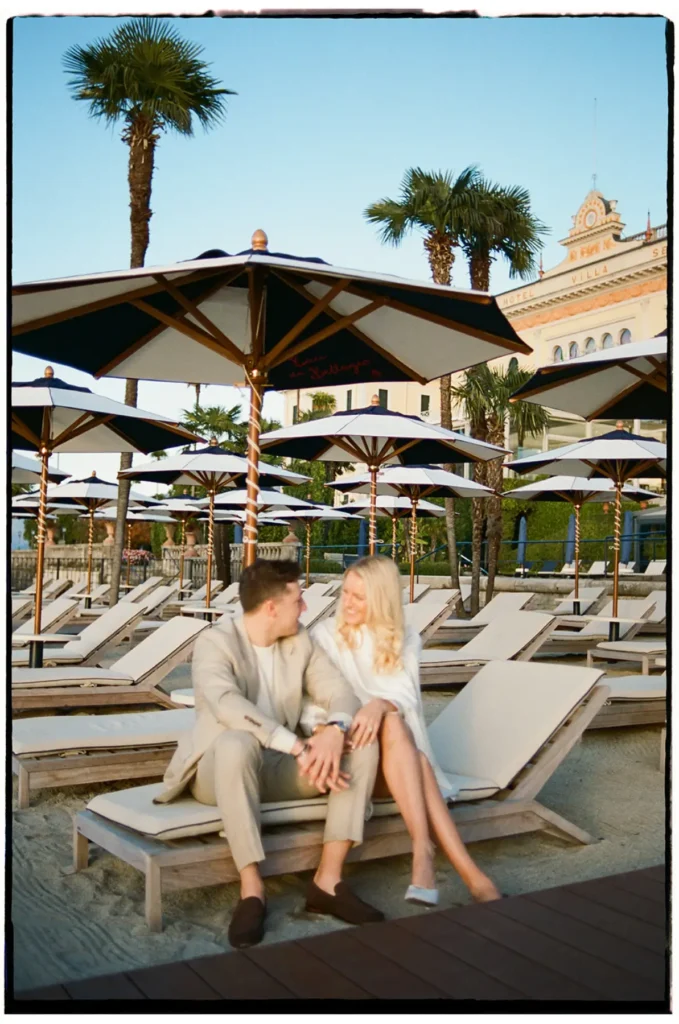 Couple seated by the pool at Grand Hotel Villa Serbelloni Bellagio, Lake Como engagement editorial vibe