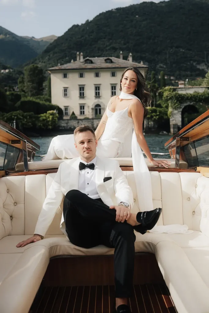 Couple portraits on a Lake Como boat with Villa Balbiano in the background