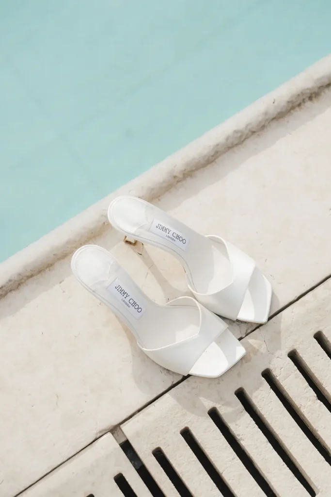 Bridal shoes by the pool at Villa Balbiano, Lake Como wedding details
