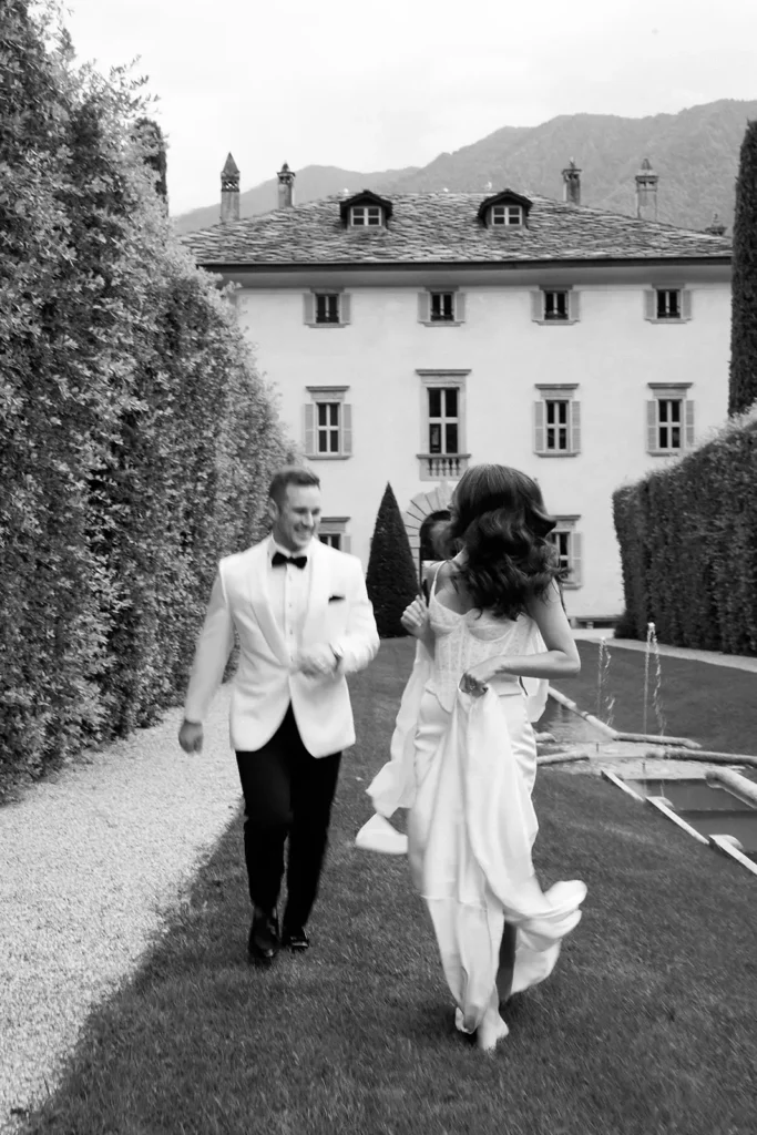 Couple walking toward Villa Balbiano, intimate Lake Como wedding - candid emotional moment